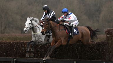 Brendan Powell rides Lord of War (left) en route to victory at Cazoo Novices'  Chase